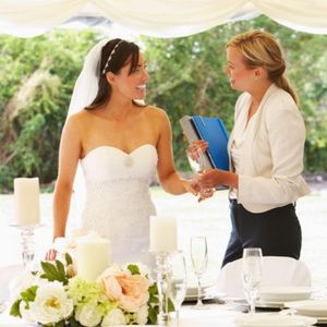 Wedding planner speaking with bride