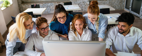 group working together around computer