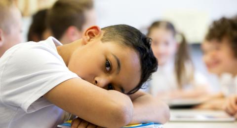 Child resting on desk