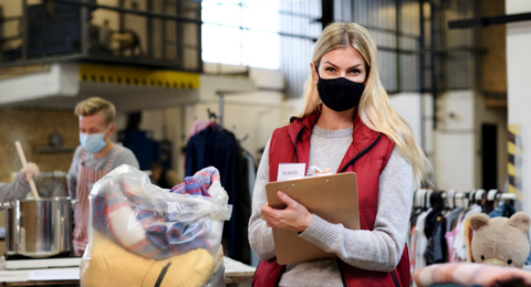 woman with clipboard and volunteers