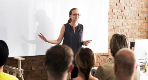 woman leading company training in classroom