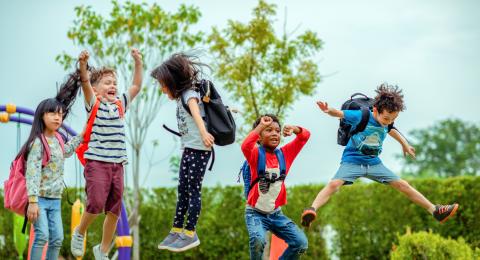 Children hopping and playing at an outdoor playground