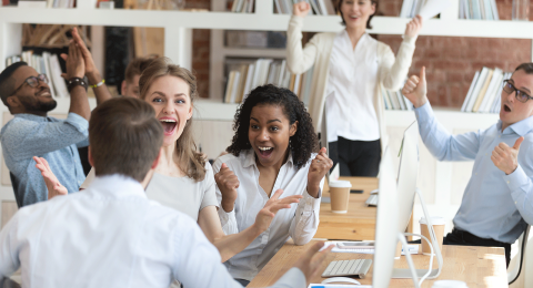 people in an office celebrating