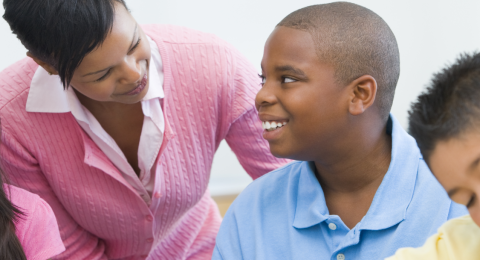 teacher working with students