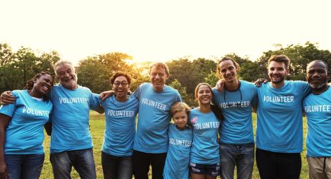 line of people wearing volunteer shirts