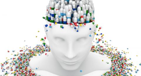 computer image of bust with brain filled with pills