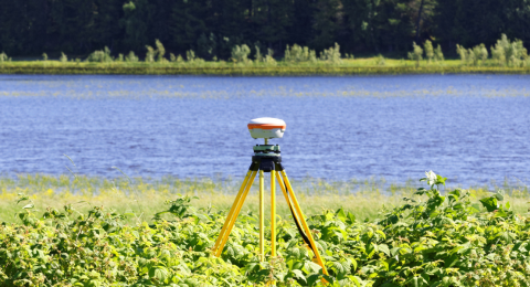 Geodetic GNSS receiver installed on river bank 