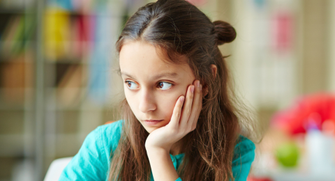 distracted girl sitting in classroom