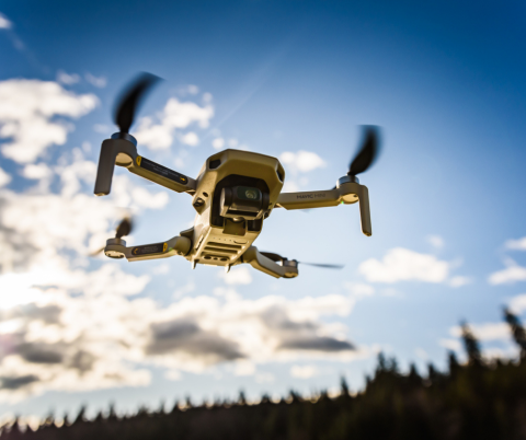 drone flying over landscape with clouds