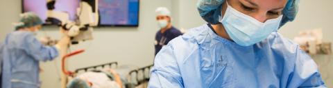 healthcare worker wearing scrubs and a mask