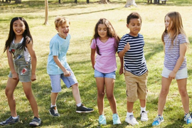 5 happy children playing outside