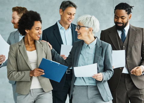 Business people walking and chatting about paperwork