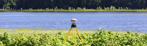Geodetic GNSS receiver installed on river bank 