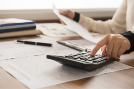 hands working at calculator
