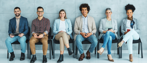 people in chairs waiting for interview