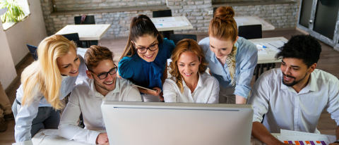 group working together around computer