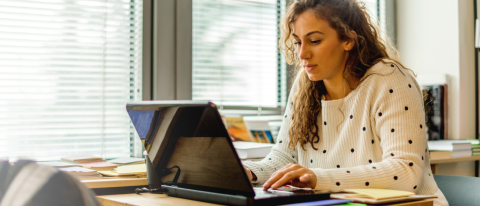 woman studying at laptop